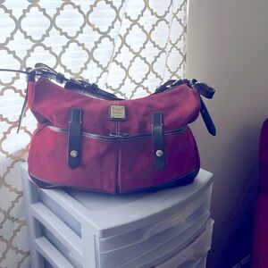 Burgundy bag you can wear on wrist or shoulder